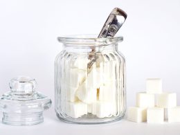 close up photo of sugar cubes in glass jar